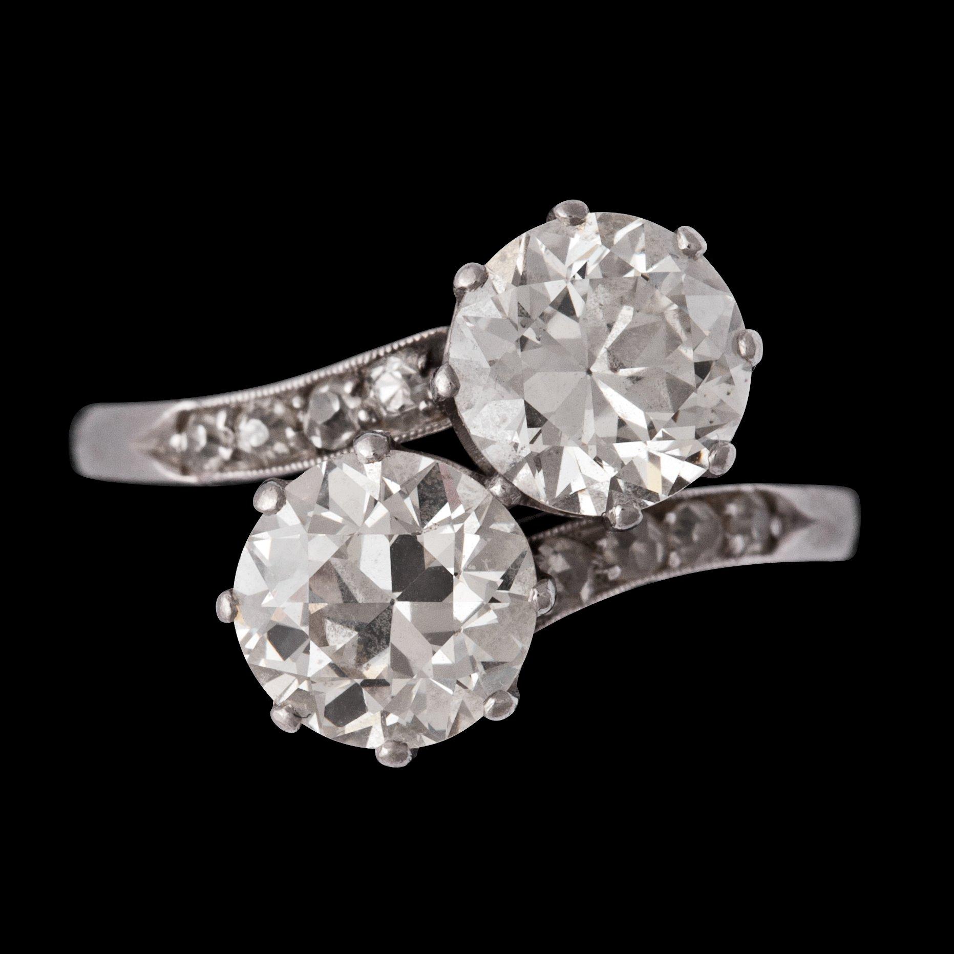 An old cut two stone diamond ring, each app. 1.30 cts.