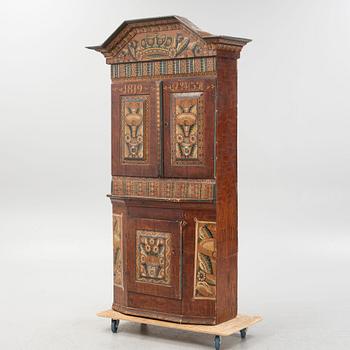A Swedish traditional painted cabinet, dated 1819.