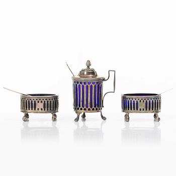 Two silver salt cellars, and a mustard pot, French hallmarks, late 18th Century.