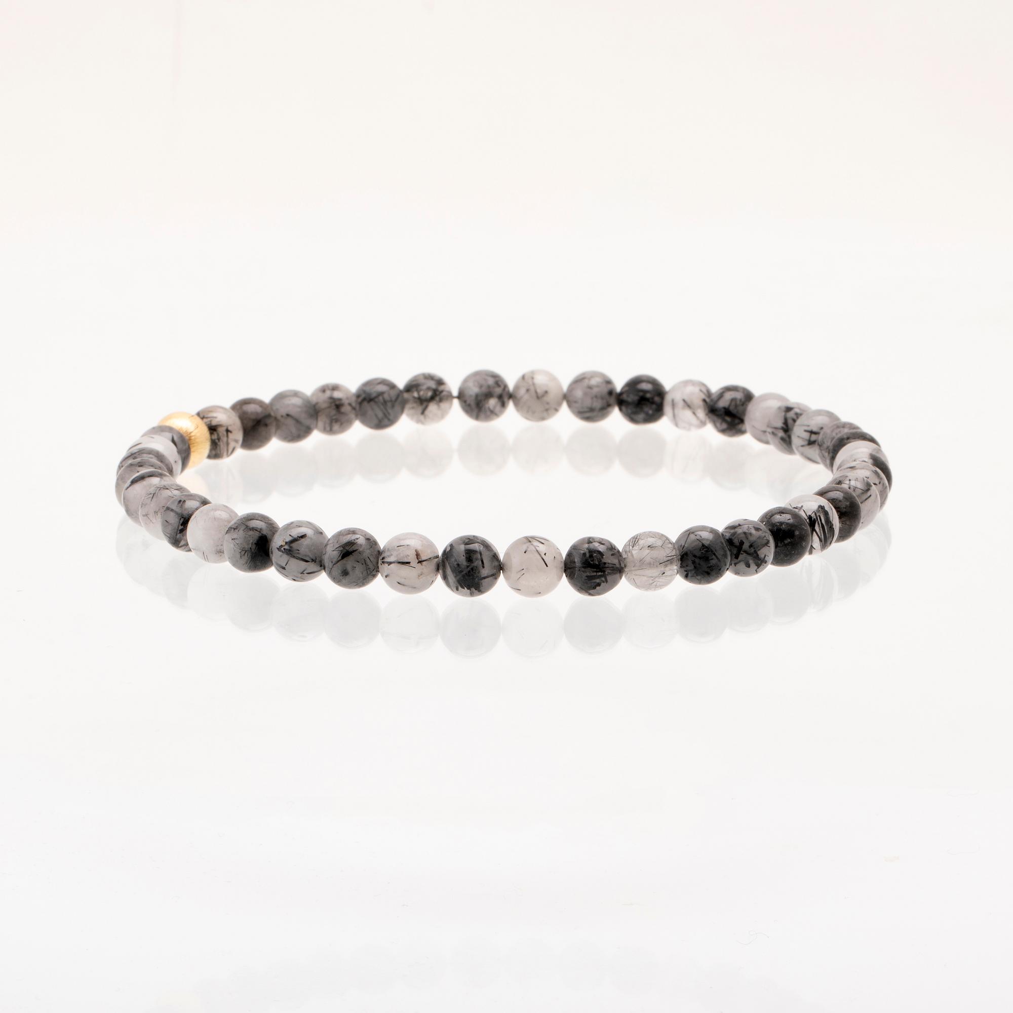 Ole Lynggaard, two necklaces and clasp in 18K gold.