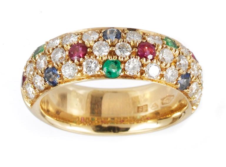 A ring, set with diamonds, sapphire, ruby and emeralds.