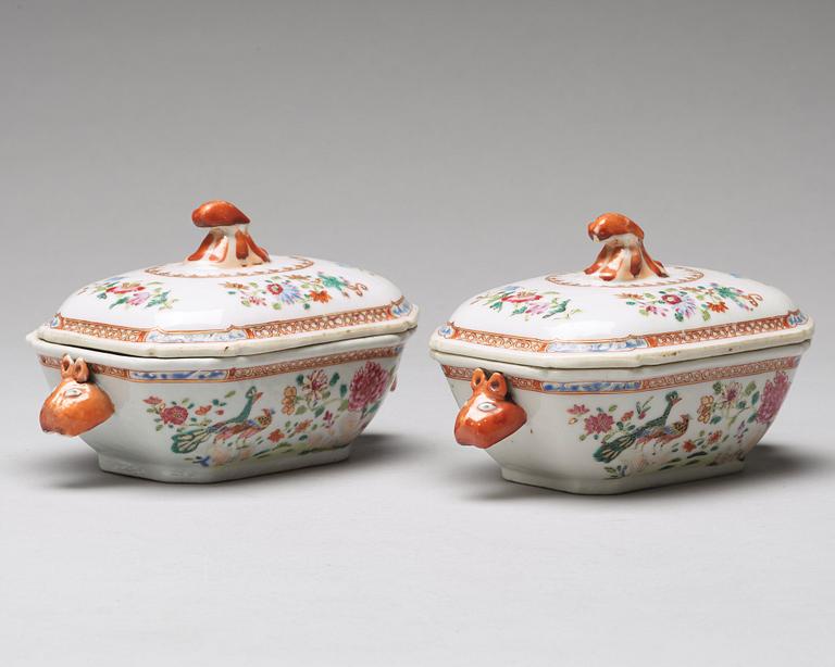 A pair of famille rose 'double peacock' butter tureens with covers and stands, Qing dynasty, Qianlong (1736-95).