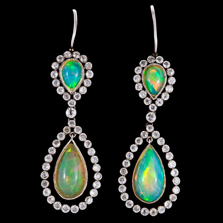 A pair of opal and diamond earrings, tot. app 0.90 cts.