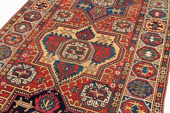 An antique Konya long rug, c. 324 x 144 cm.