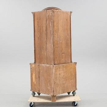A 18th century corner cabinet.