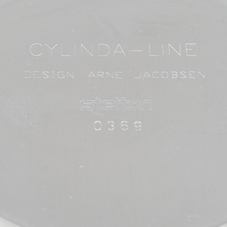 Arne Jacobsen, a 100-year jubilee "Cylinda" stainless steel tea set and a book, Stelton, Denmark, 2002.