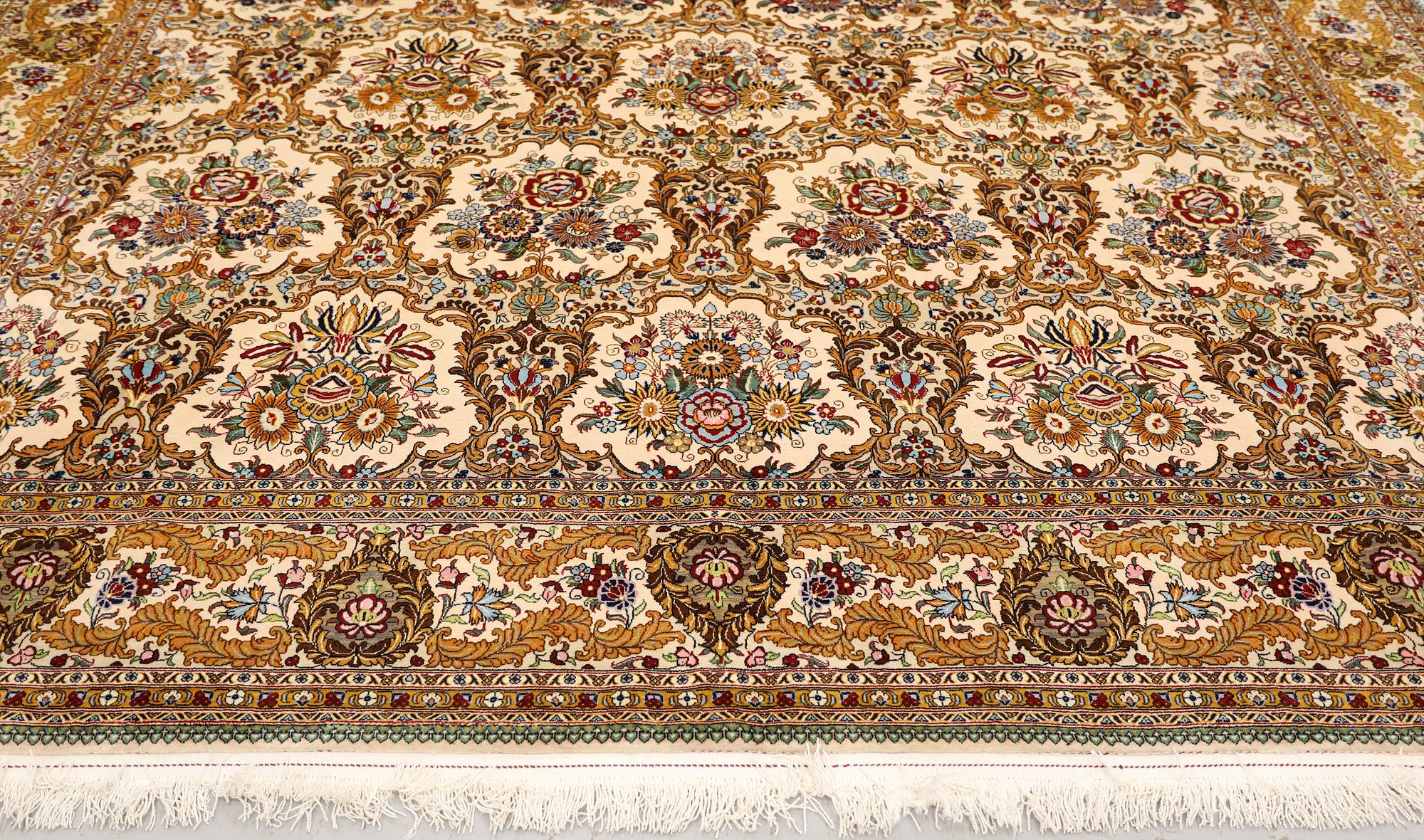 A part silk Ghom carpet, c. 420 x 310 cm.