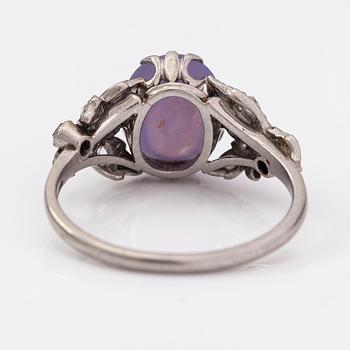 Oskar Pihl, A platinum ring with a ca. 4.0 ct star sapphire and rose-cut diamonds ca 0.12 ct in total. A Tillander 1930s.