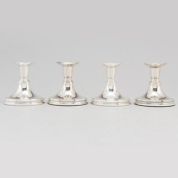 a set of four silver candle sticks by Eric Löfman for MGAB 1959-1975.