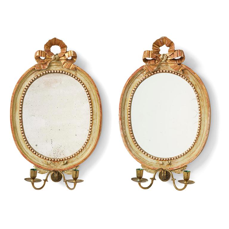 A pair of Gustaviantwo-branch giltwood girandole mirrors by C. G. Fyrwald (master in Stockholm 1776-1825).