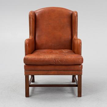 A leather upholstered easy chair, second part of the 20th Century.
