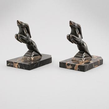 BOKSTÖD, 1 par, patinerad metall, signerade H Moreau, 1900-talets första hälft.