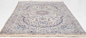 A Nain carpet, c. 310 x 195 cm.