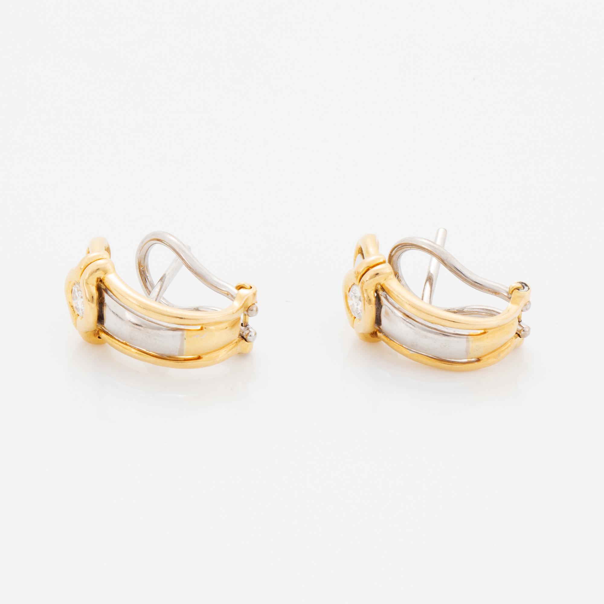 A pair of 18K gold earrings.
