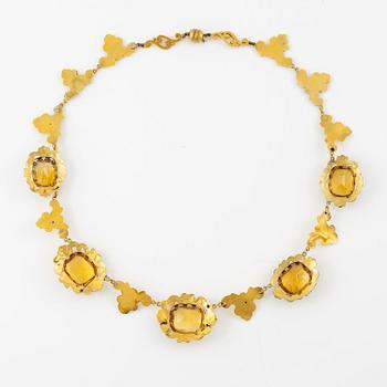 A necklace and a pair of earrings in 14K gold with faceted citrines.