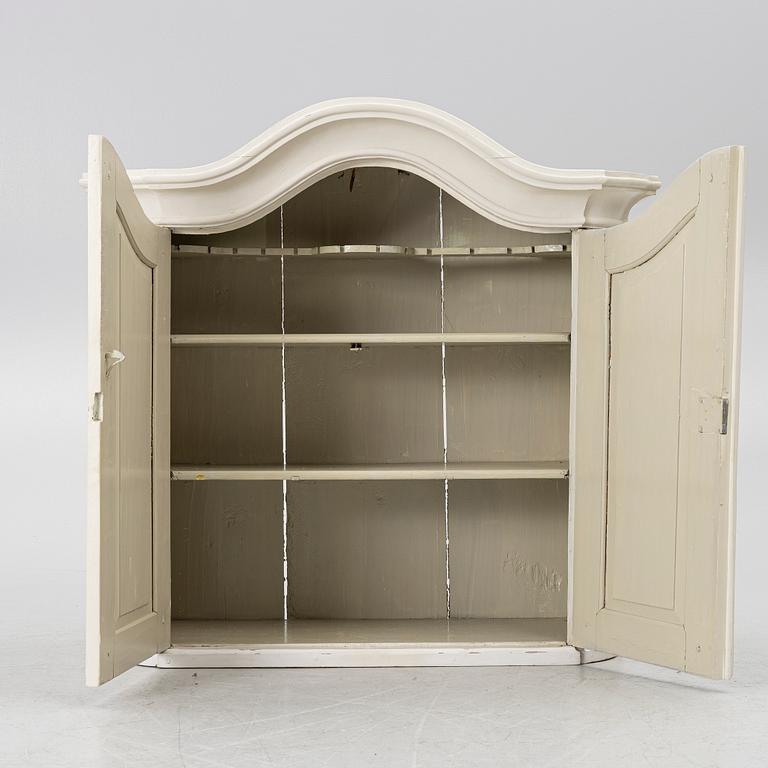 A Swedish rococo hanging cabinet, mid 18th century.