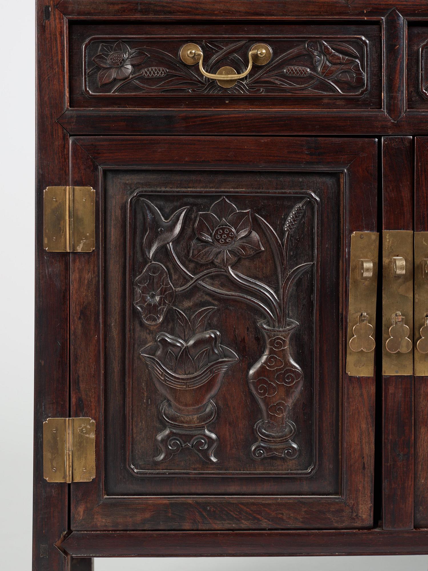 A pair of Chinese hardwood display cabinets, Qing dynasty, 19th Century.