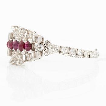 A bracelet platinum set with old- and baguette-cut diamonds and cabochon-cut rubies, circa 1930-40s.