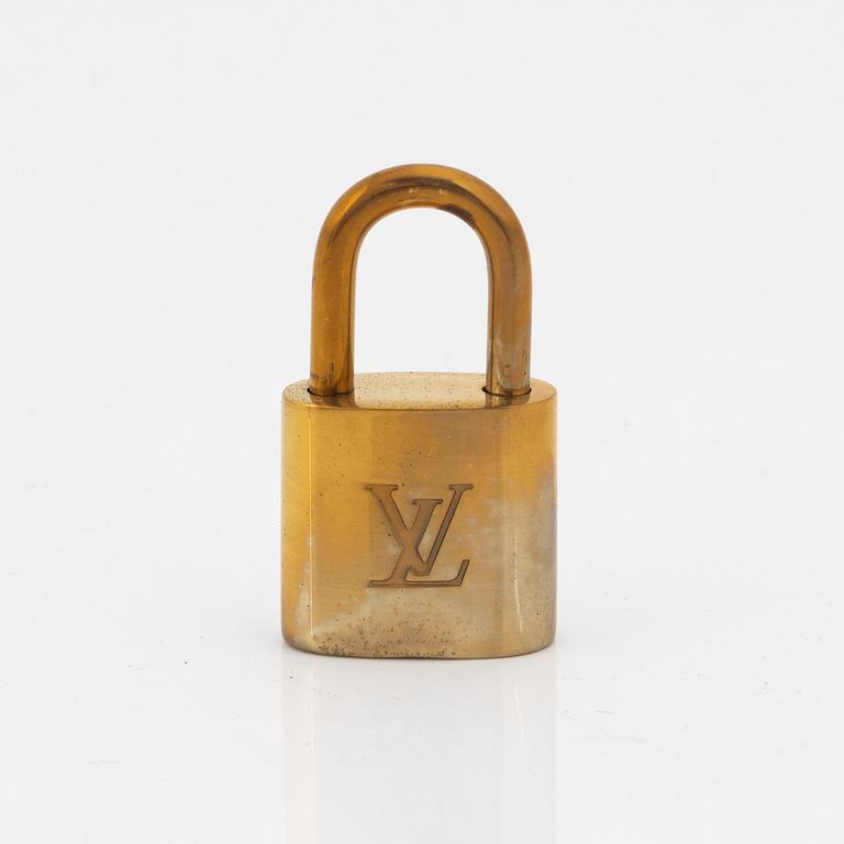 Louis Vuitton, 10 brass padlocks.