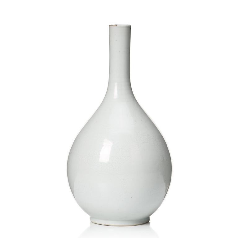 A white glazed anhua decorated vase, 18th Century, with Yongzheng four character mark.