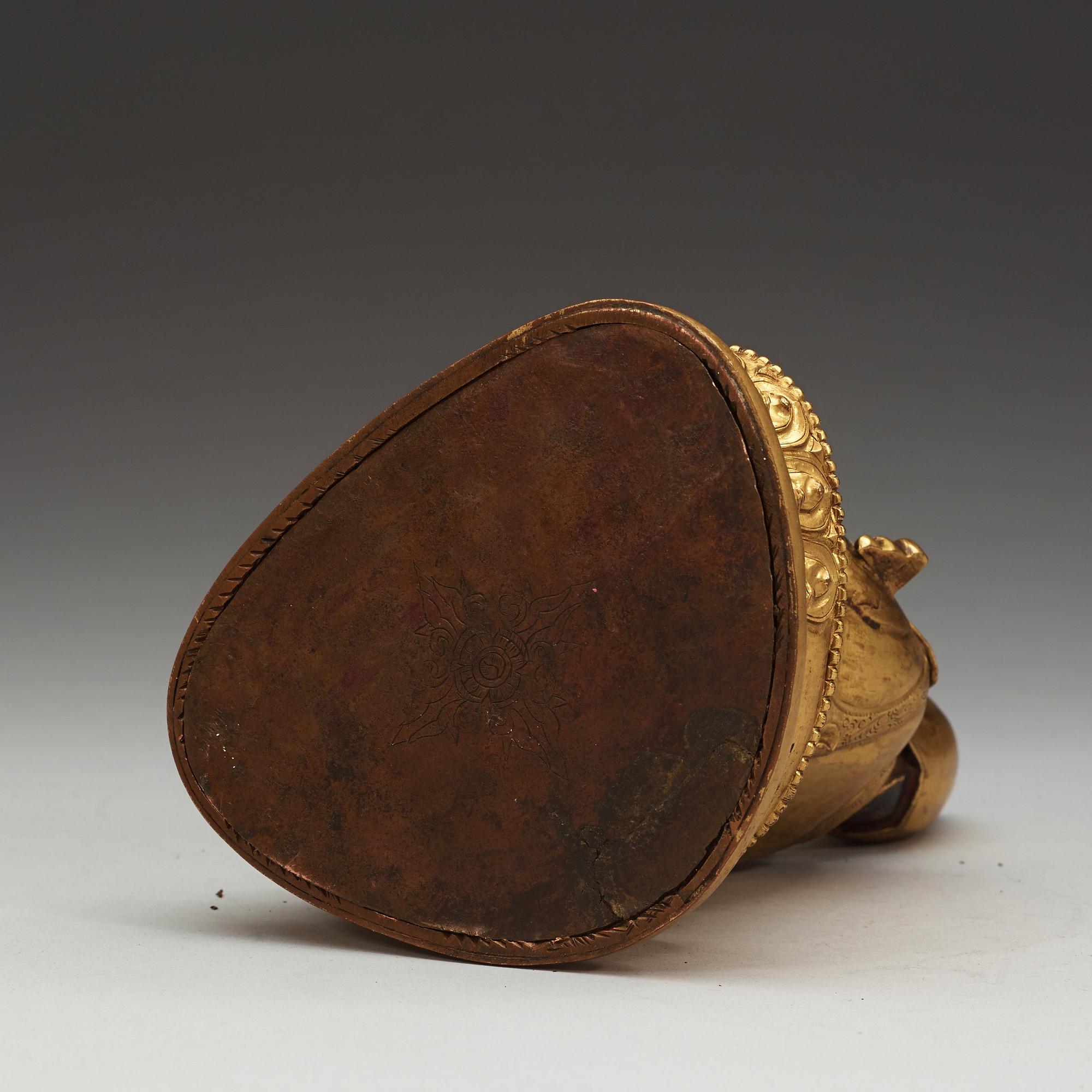 A Sino-Tibetan gilt copper alloy repoussé figure of Tsong Khapa, 18/19th Century.