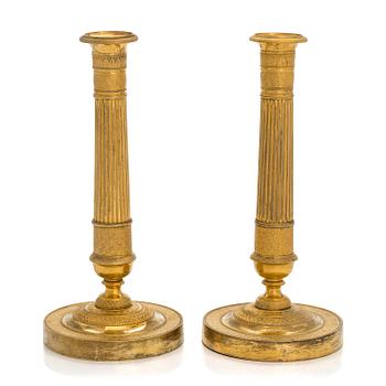 A pair of early 19th century French Empire candlesticks.