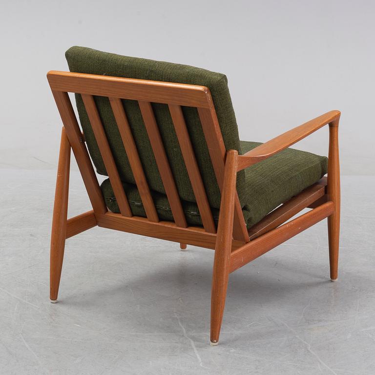 A 1950's/60's teak and oak easy chair.