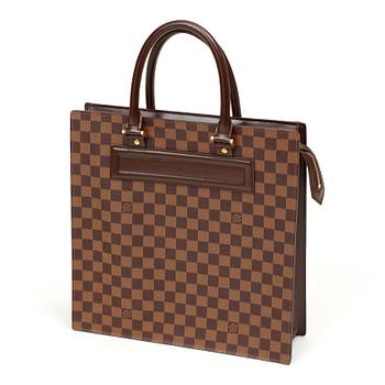 580. A 1990s damier ebene canvas handbag by Louis Vuitton.