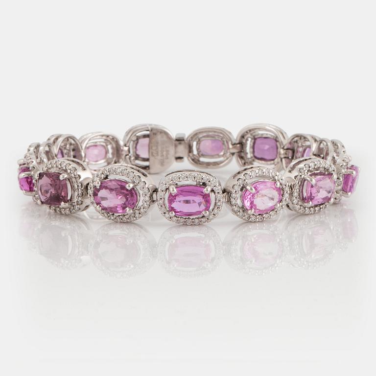 An 18K white gold bracelet set with faceted pink sapphires and round brilliant-cut diamonds.