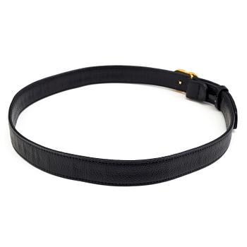 A black leather belt by Chanel.