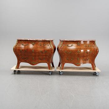 A pair of rococo style chest of drawers, mid 20th Century.