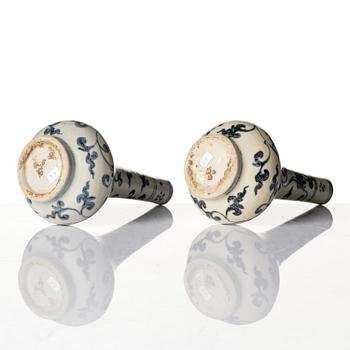 A pair of blue and white lotus vases/water sprinklers, Ming dynasty (1368-1644).