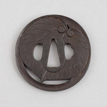 Tsuba, Japan, signed Echizen Ju Kinai, mid-1600s.