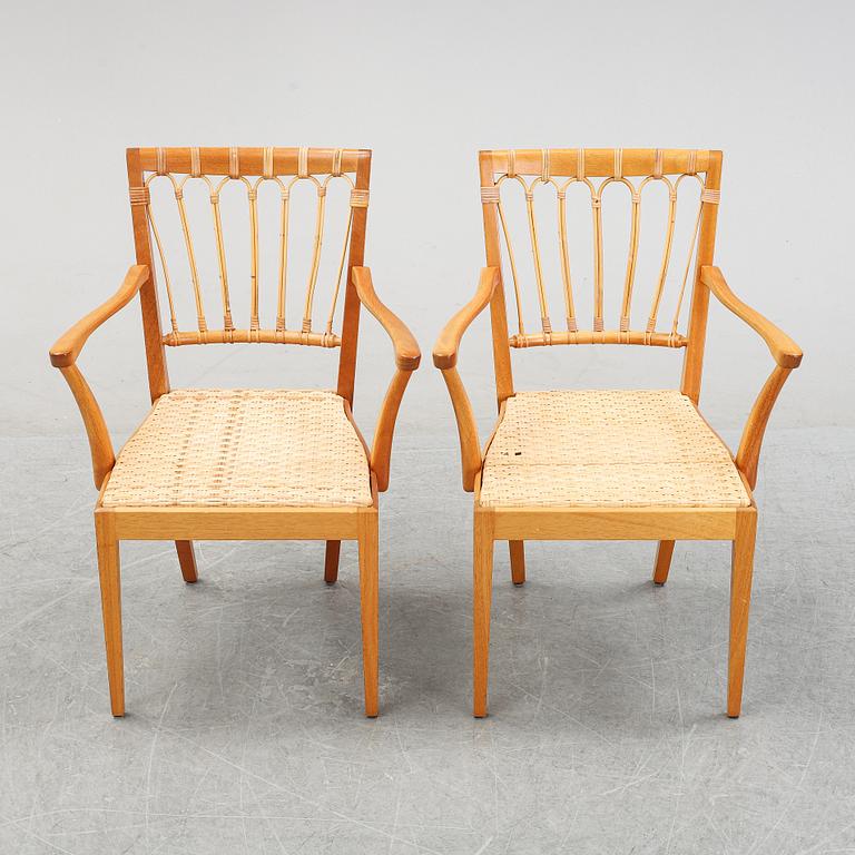 A pair of mahogany armchairs, model 1165, designed by Josef Frank in 1946 for Firma Svenskt Tenn.