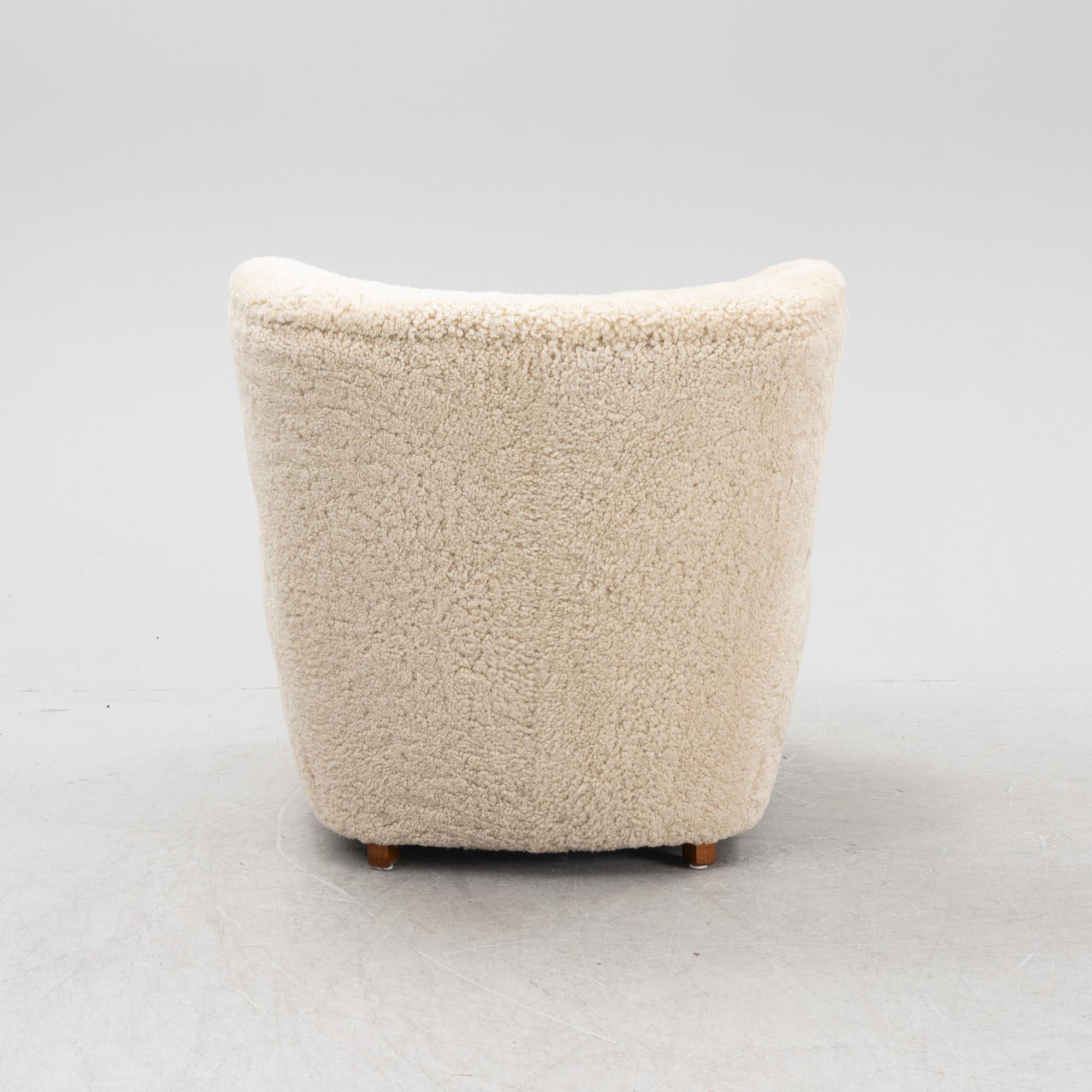 A lounge chair with new sheepskin upholstery, Denmark, 1940's.
