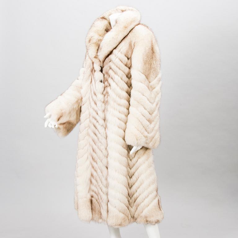 Off-white fox fur coat.