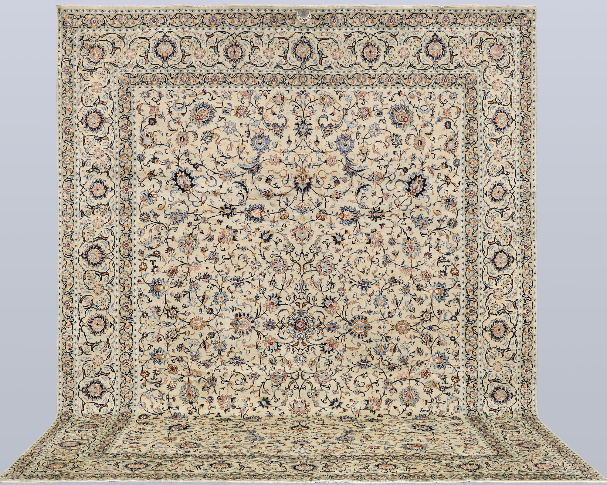 A Keshan carpet, signed, approx. 410 x 323 cm.