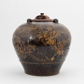 A large brown glazed marthaban jar, presumably late Ming dynasty (1368-1644).