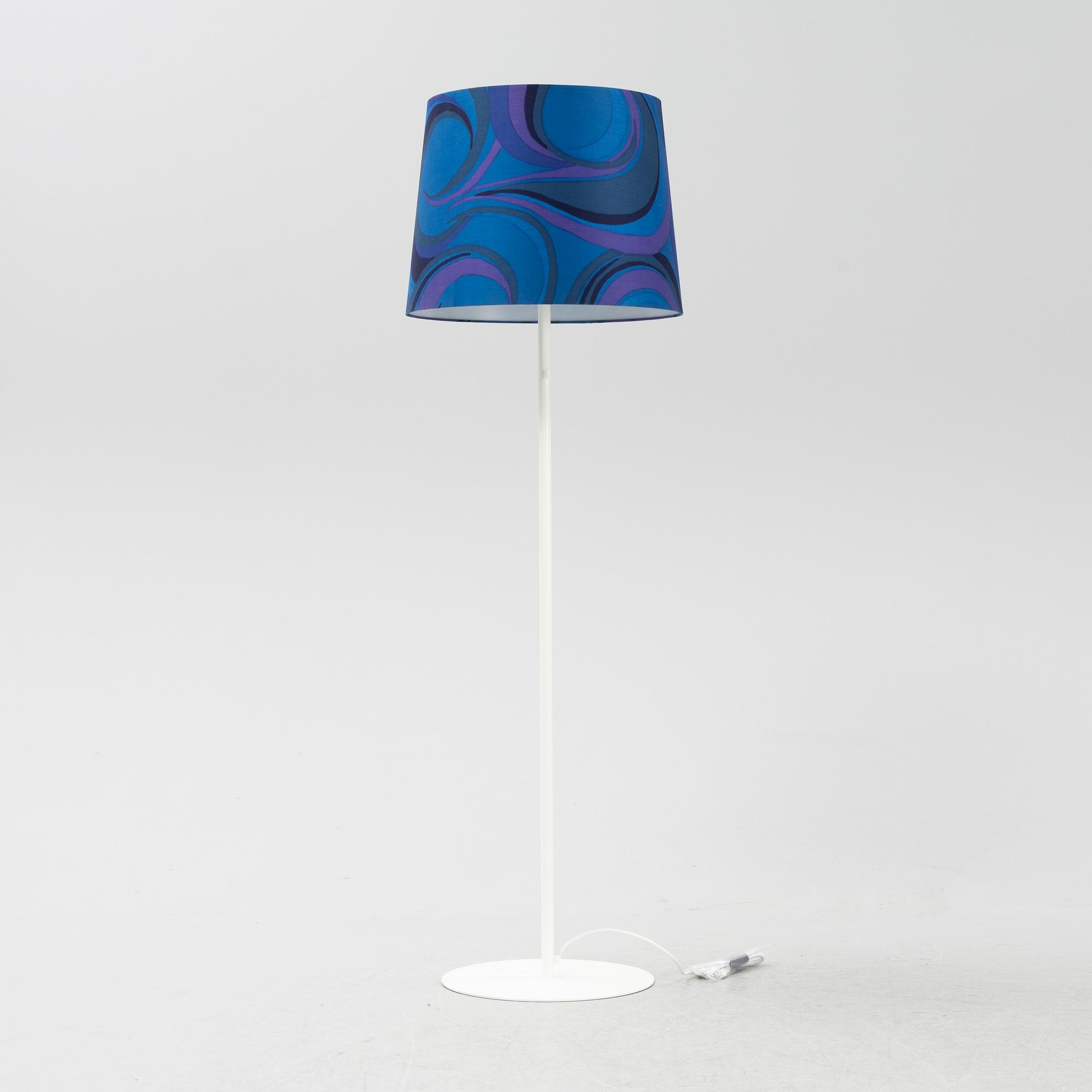 A white metal floor light, Luxus, Vittsjö.