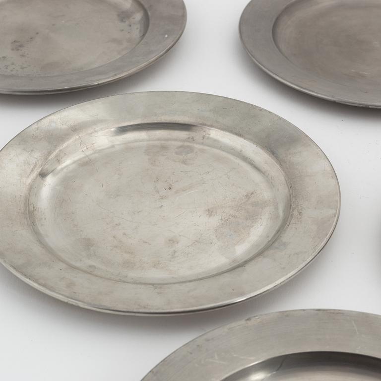 A set of six pewter plates from Firma Svenskt Tenn, including Stockholm 1968.