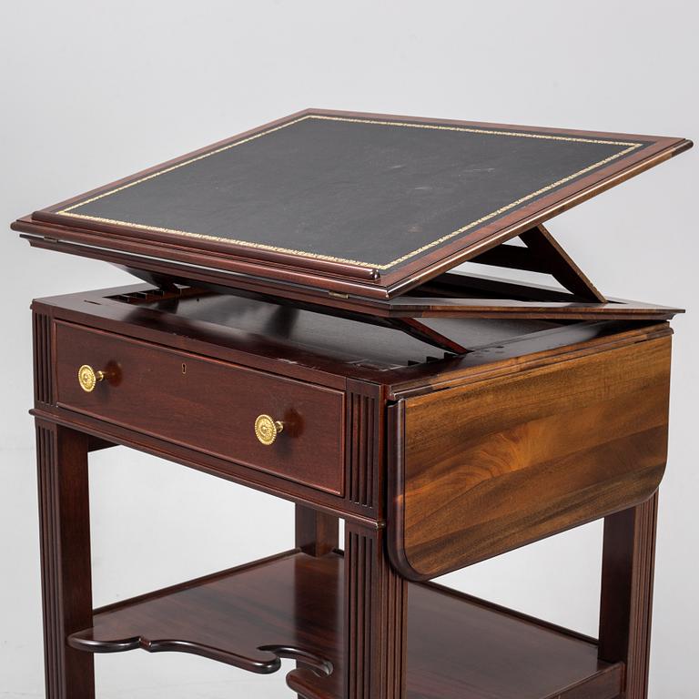 a mahogany writing desk from the second half of the 20th century.