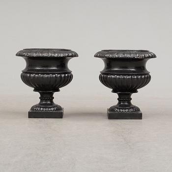 A pair of cast iron plant pots. Late 20th century.