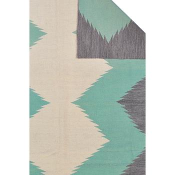 A kilim carpet, ca 303 x 250 cm.