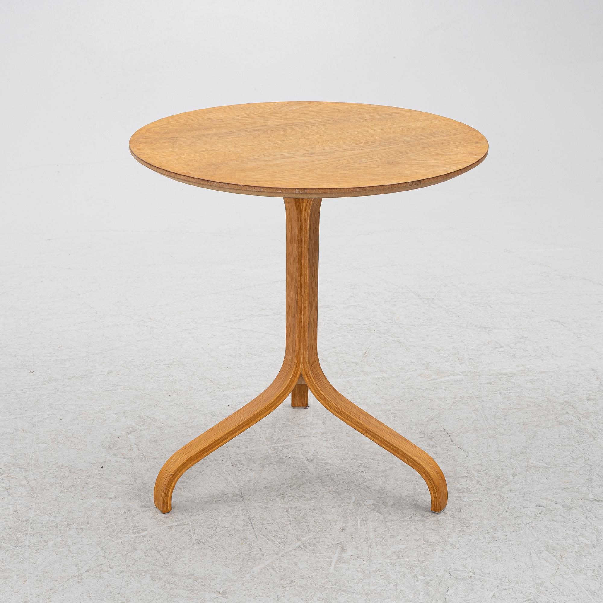 Yngve Ekström, a 'Lamino' armchair with ottoman and sidetable, Swedese, Sweden, 21st century.