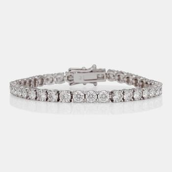 A line bracelet with 37 brilliant cut diamonds. Total carat weight 12.00cts.