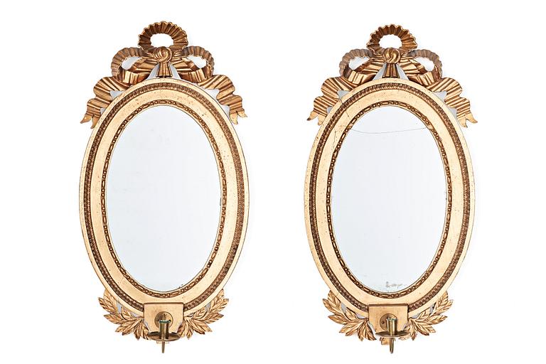 A pair of late Gustavian late 18th century one-light girandole mirrors.