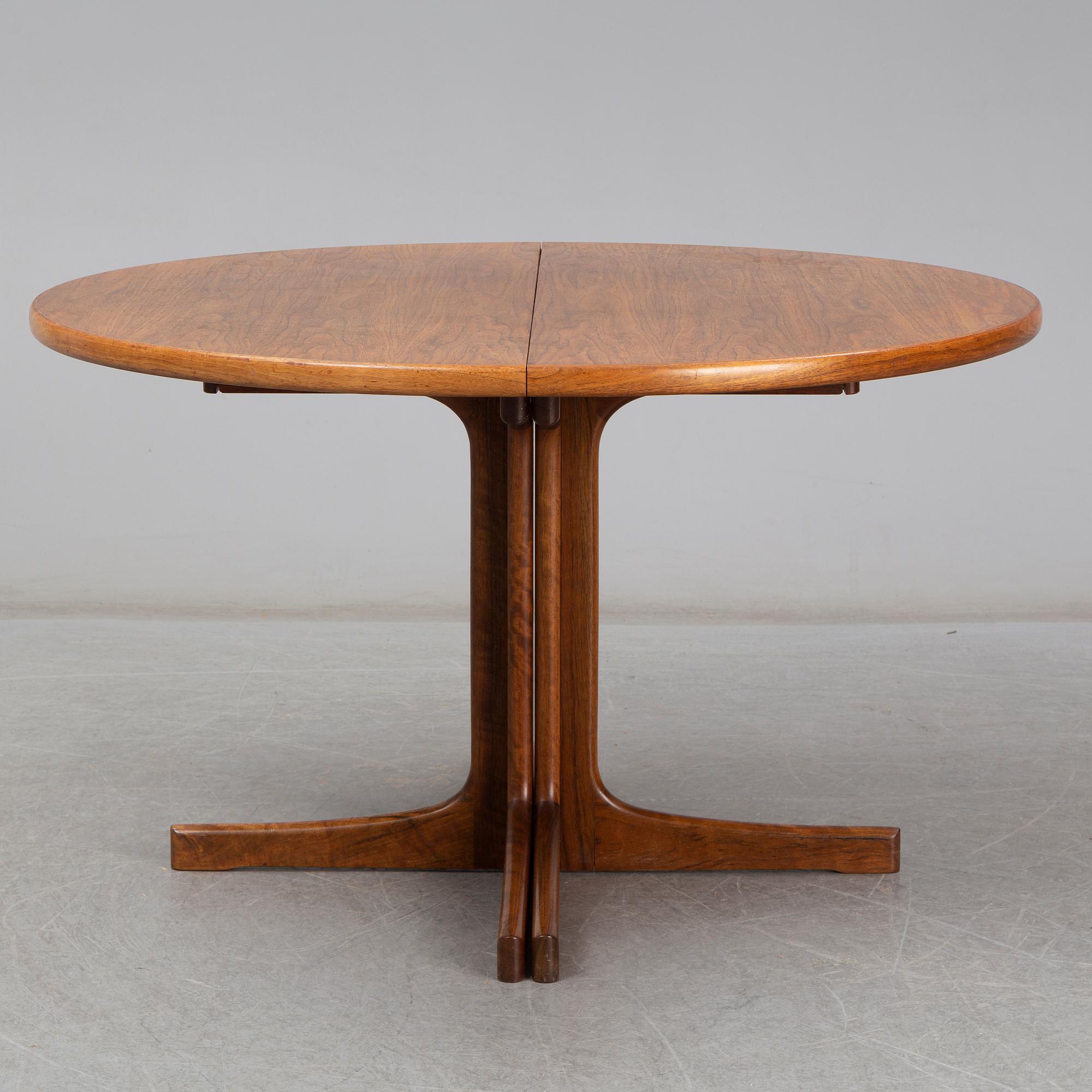 A walnut vereered dining table, mid 20th Century.