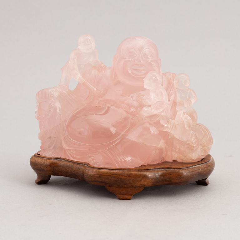 A rose quartz figure of buddai, China, 20th Century.