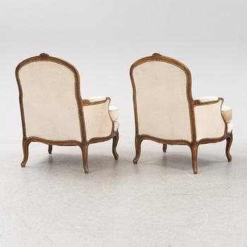 A pair of Louis XV-style lounge chairs, 20th Century.