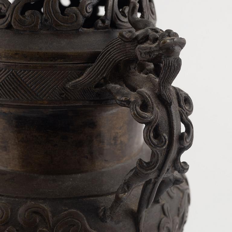A tripod bronze censer with cover, Qing dynasty, 19th century.